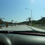 Go figure. This is a dirt road all along except this quarter mile or so where, for no apparent reason, they built a nice wide street with sidewalks, lights and benches. Then the dirt road continues. Typické nevyzpytatelné Mexico. Kostrbatá nedlážděná cesta, se  najednou bez zjevného důvodu změní v širokou dlážděnou ulici s chodníky a pouličním osvětlením. Po pár stech metrech pokračuje kostrbatá nedlážděná cesta. : Baja2011